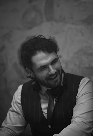 Trim Biba behind the decks, black and white portrait