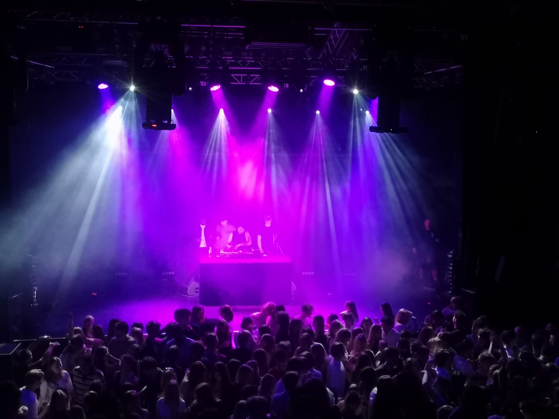 Wide view of a packed dancefloor at one of Trim Biba's sets