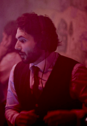 Trim Biba in red light behind the decks